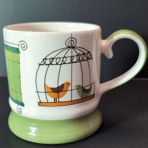 Pier 1 Hand painted Stoneware Green/White Coffee Mug with Birds in Cages Design.